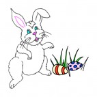 White bunny with easter eggs laying on the grass, decals stickers