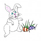 White bunny with easter egg laying on the grass, decals stickers